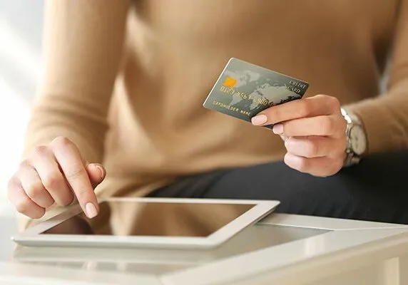 Girl with tablet and credit card